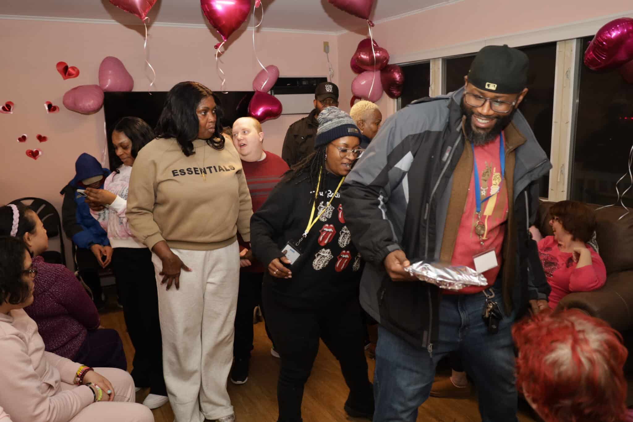 Evers Street residents and staff dance at the Valentine's Day party
