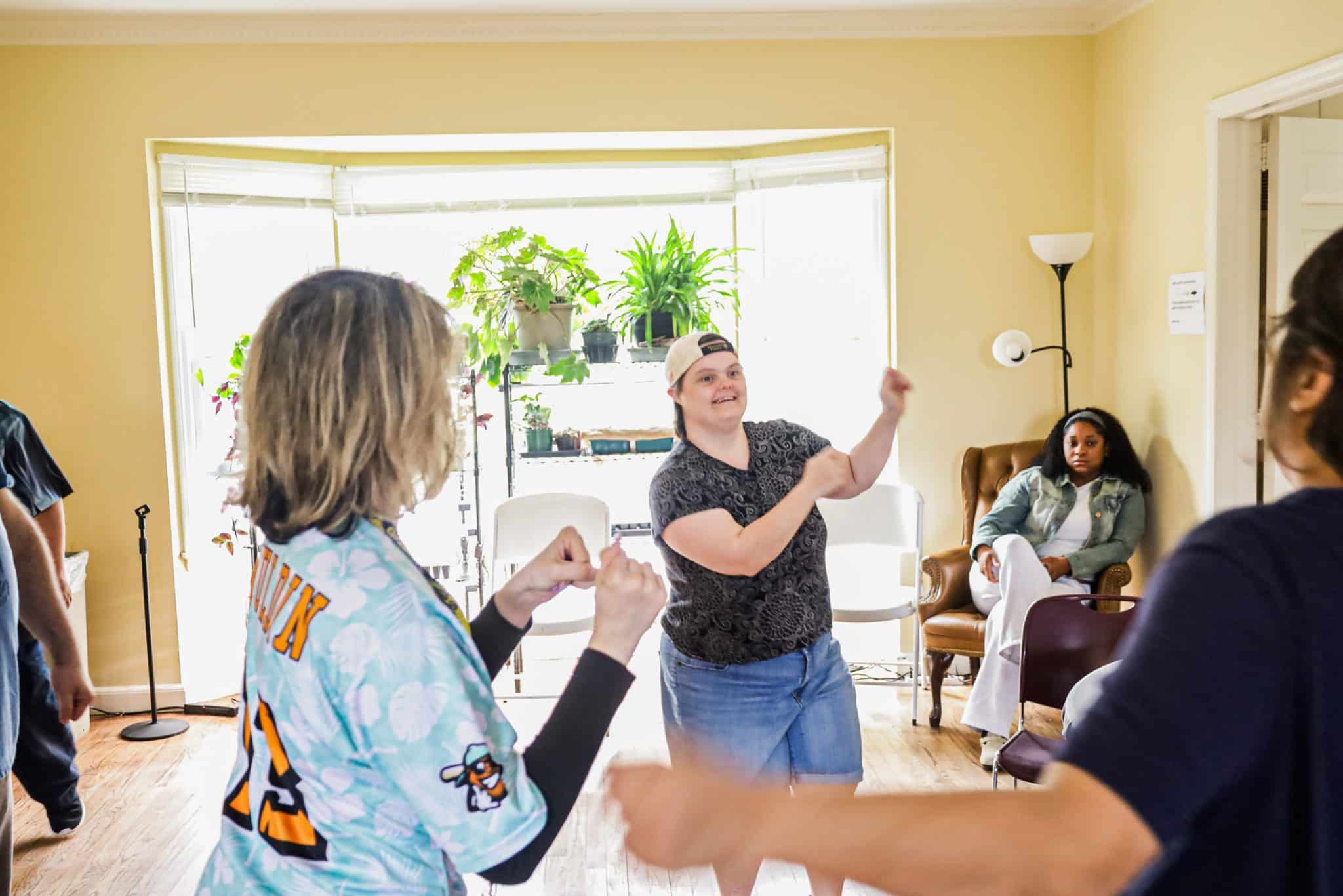 Elise Olson instructing others to do Zumba at Wheatley Farms and Arts Center