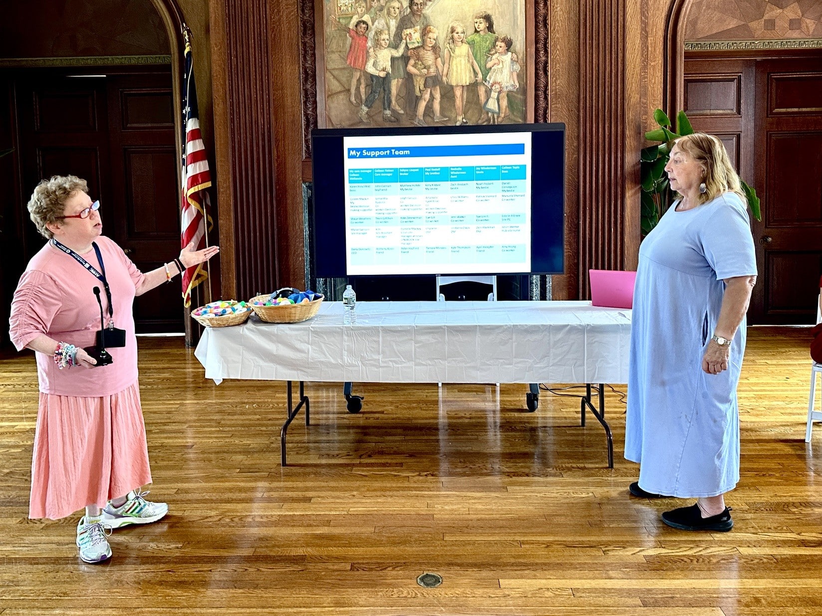 Michelle gives her presentation alongside a member of her support team.