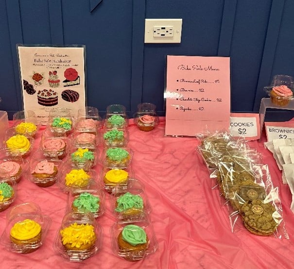 give back 2 | AHRC Nassau Cupcakes and baked goods on a table at a bake sale.