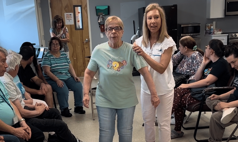 Volunteer Marianne Barbera hosting her weekly dance class