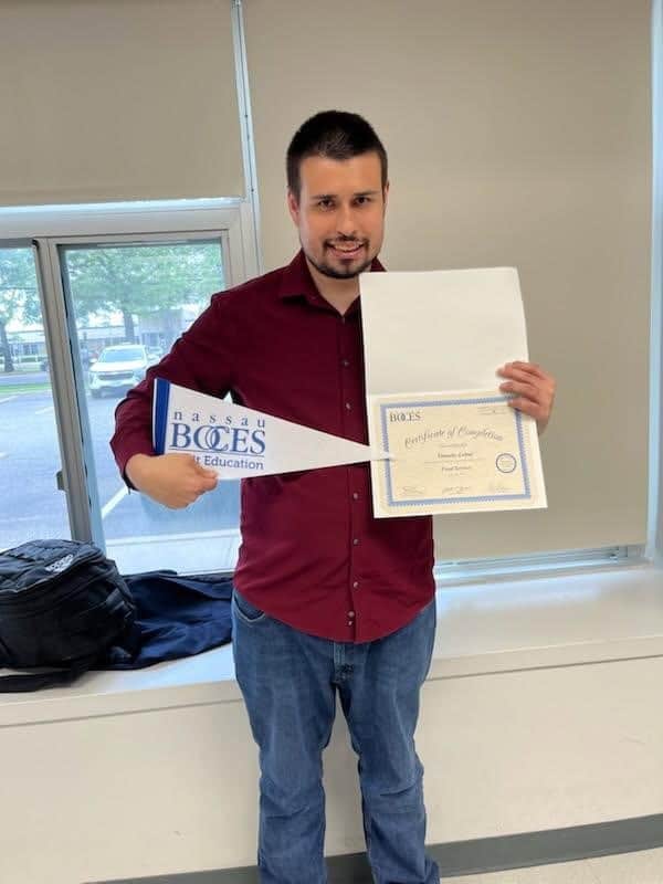 Timothy Lettal with his Certificate of Completion