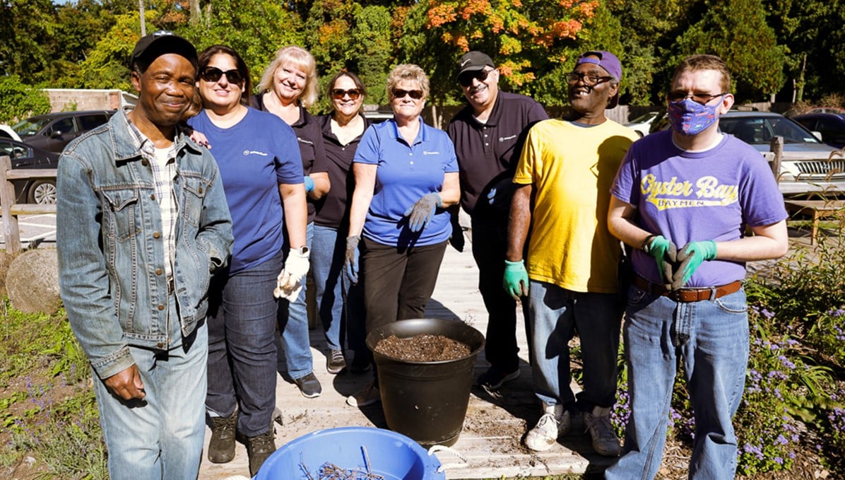 Volunteers from Webster Bank and people supported by our day program at Wheatley Farms